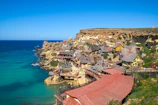 A charming beachside village with colorful houses and lively local life.