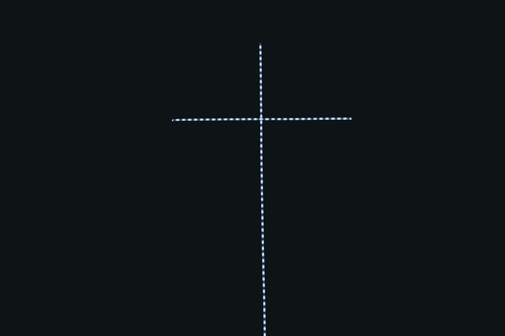 a cross that is on a black background