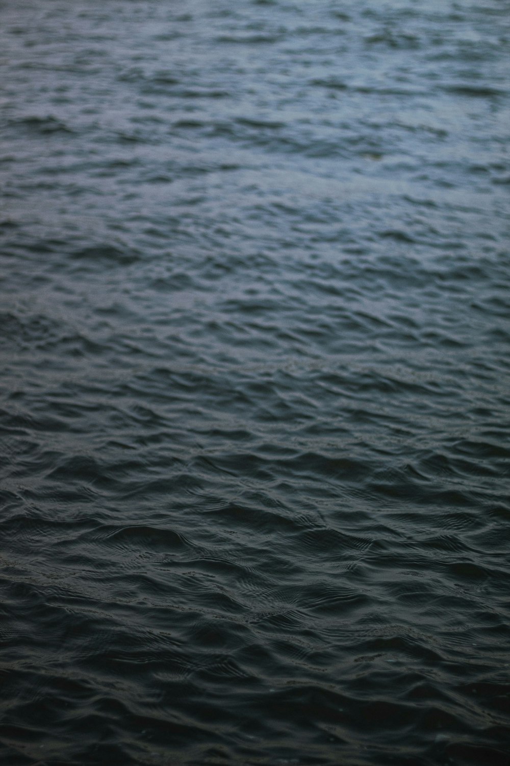 a boat floating on top of a large body of water