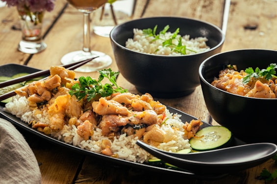 a table topped with bowls of food and rice