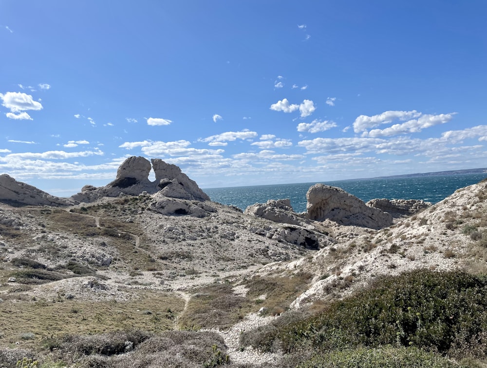 a view of the ocean from the top of a hill