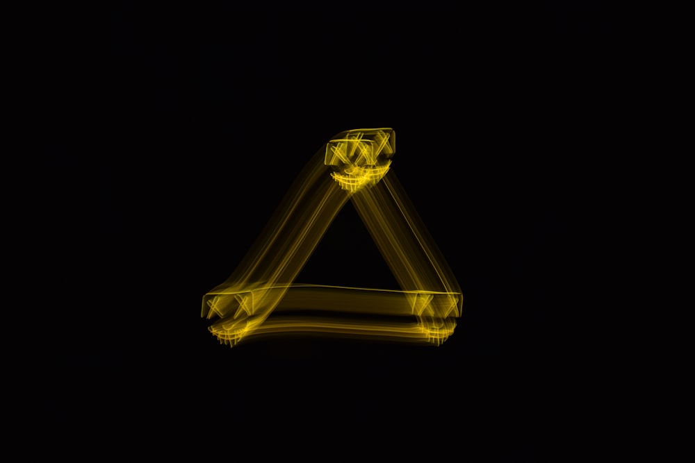 a light painting of a letter on a black background