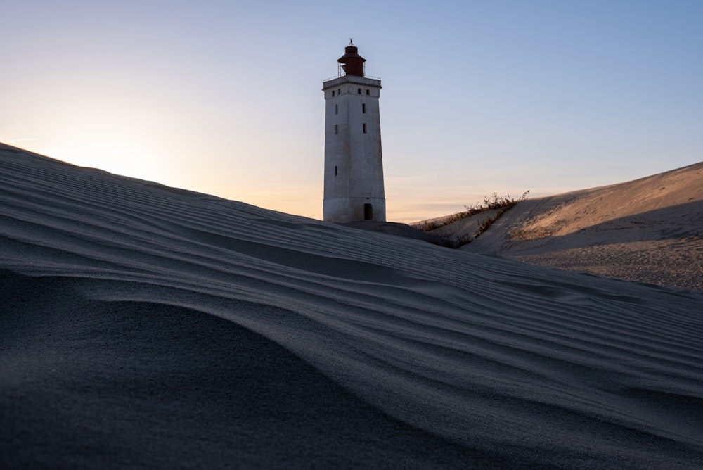 a light house in the middle of a desert