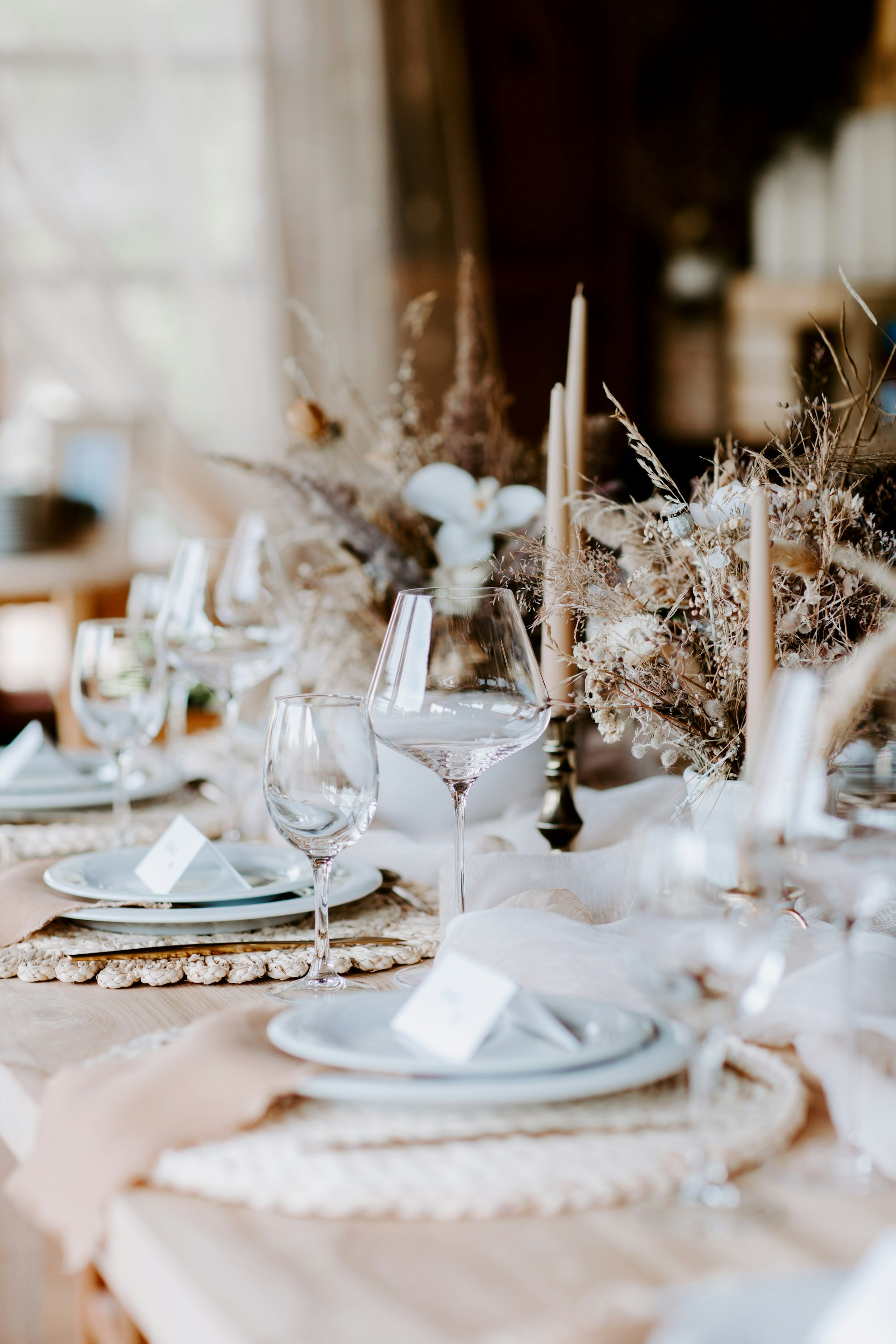 a table set for a formal dinner with place settings