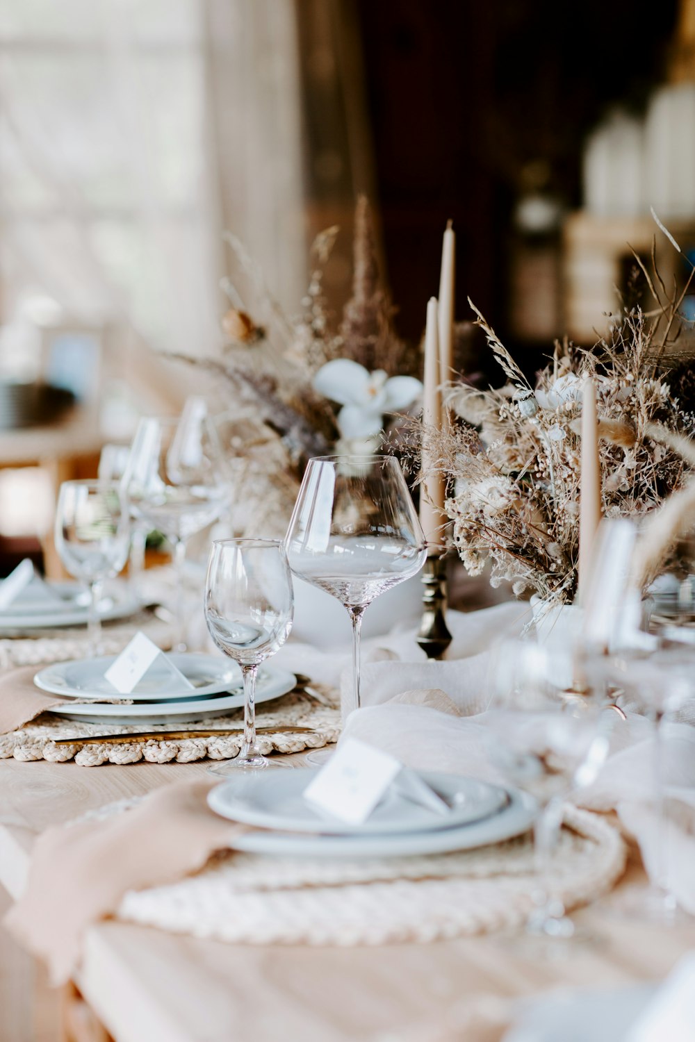 a table set for a formal dinner with place settings