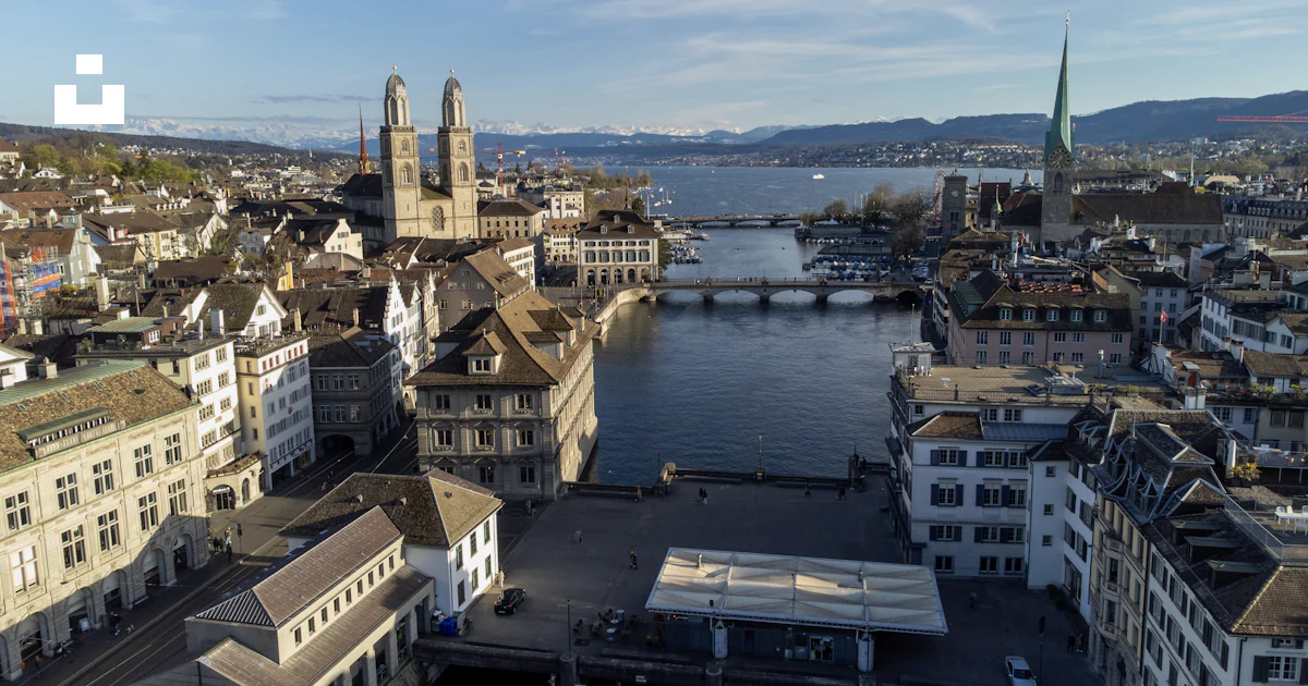 An aerial view of a city with a river running through it photo – Free ...