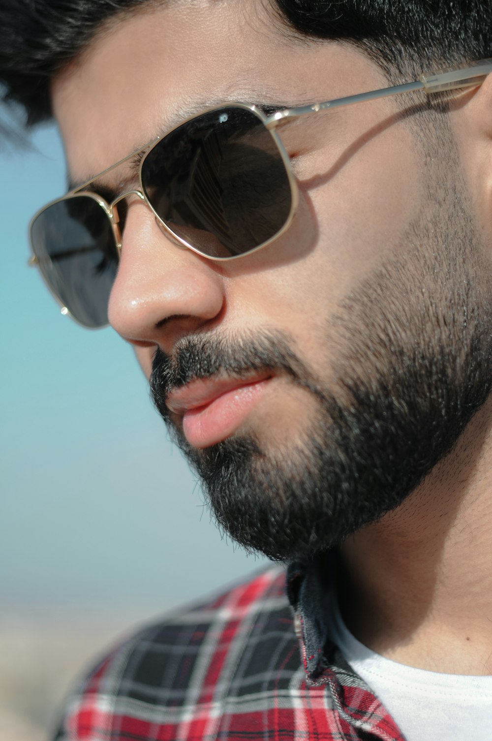 a close up of a person wearing sunglasses