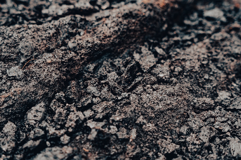 a close up of a dirt surface with small rocks