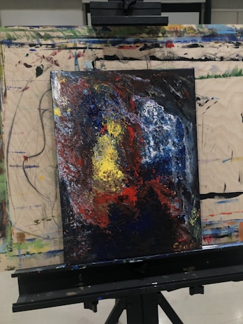 An abstract painting bursting with vibrant colors that mirror complex feelings.