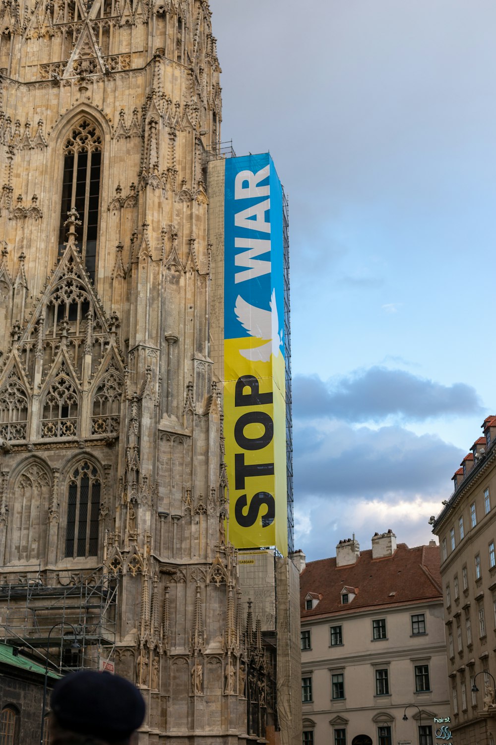 a tall building with a sign on the side of it