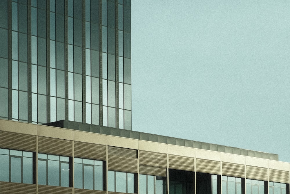 an airplane flying over a tall building in the sky