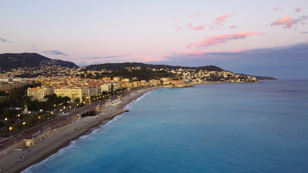 a view of a beach with a city in the background