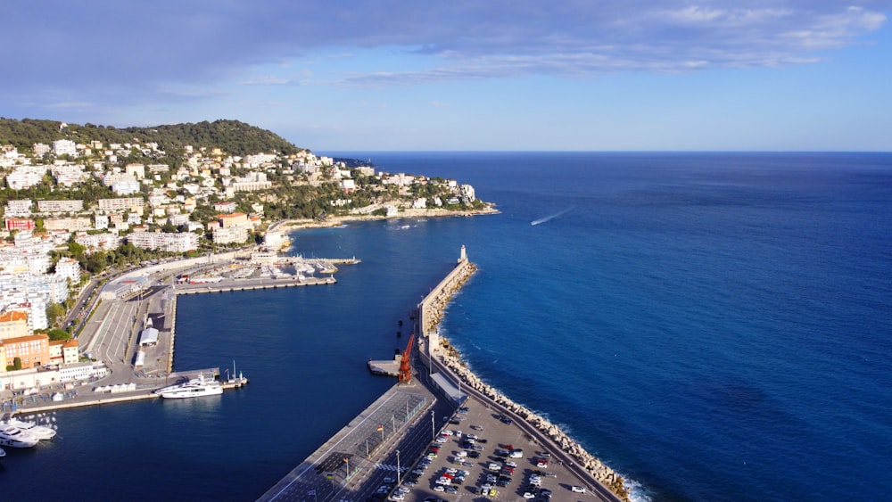 an aerial view of a city next to the ocean