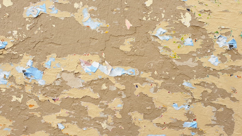 a close up of a peeling paint on a wall
