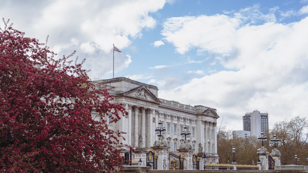 a large white building with a flag on top of it