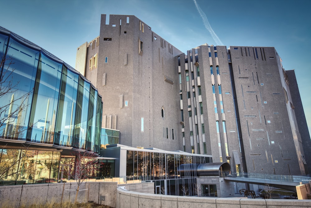 a large building with a curved walkway in front of it