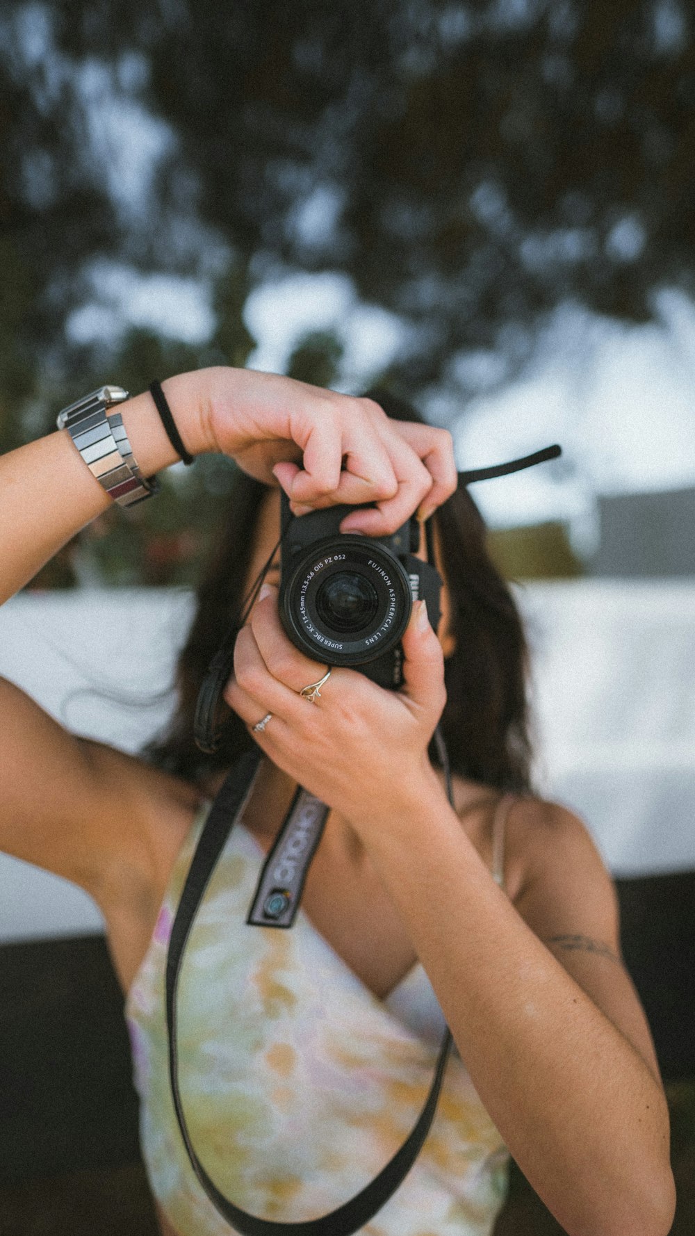 a woman taking a picture with a camera