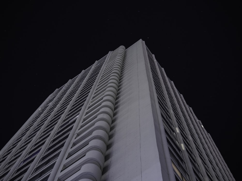 a very tall building with a sky background