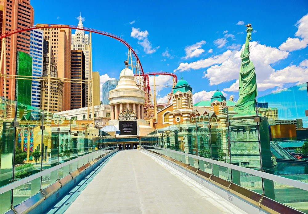 a bridge with a roller coaster in the background