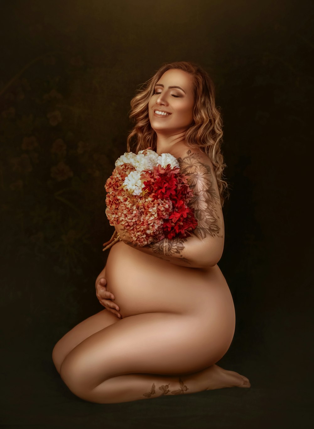 a pregnant woman holding a bouquet of flowers