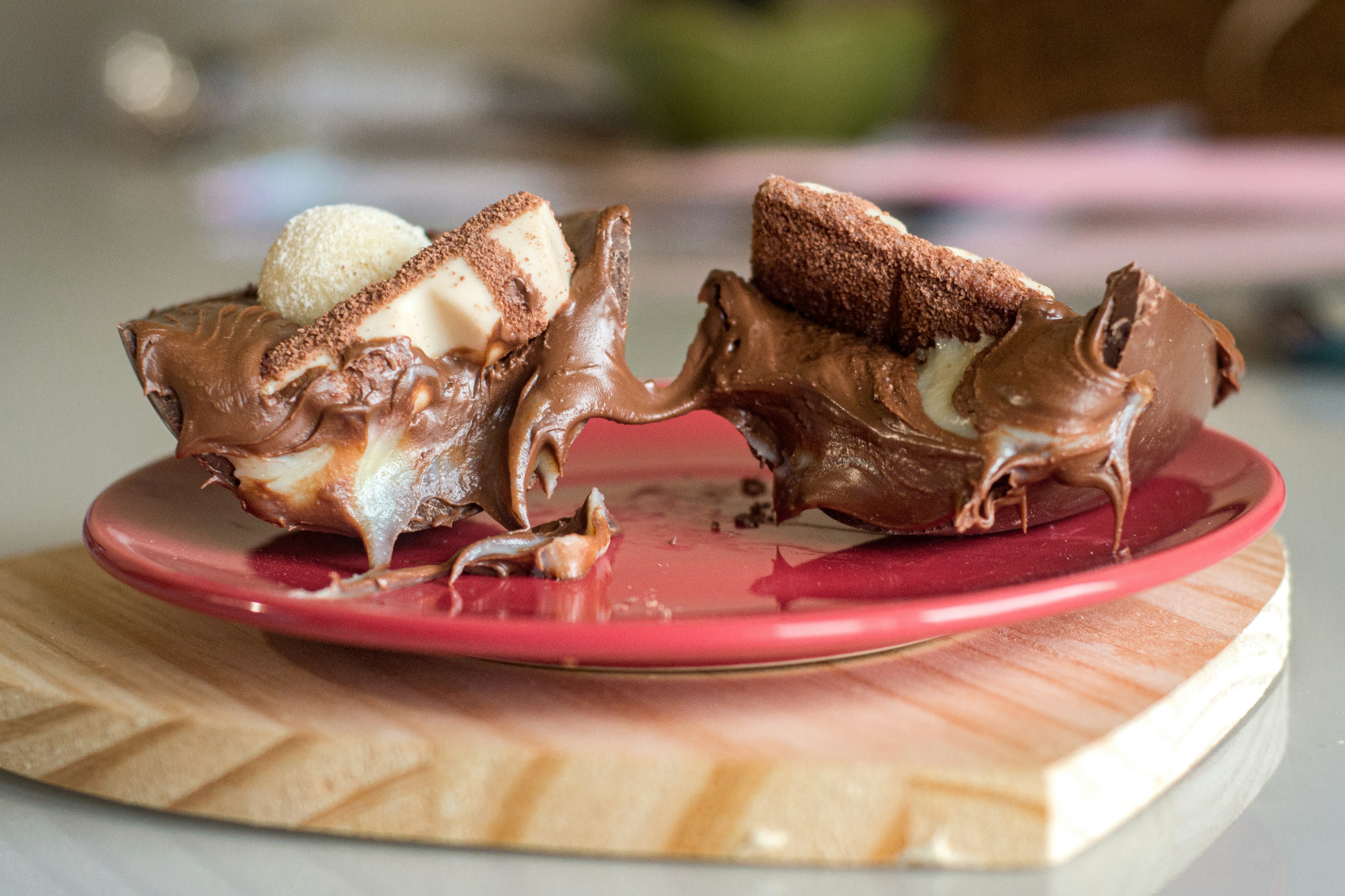 a piece of cake on a red plate on a table