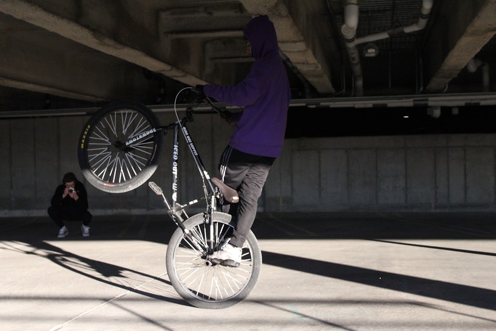 a person on a bike doing a trick in the air