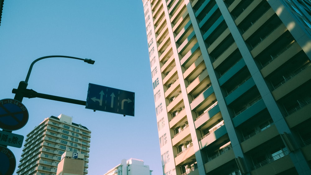 a traffic light and a street sign in a city