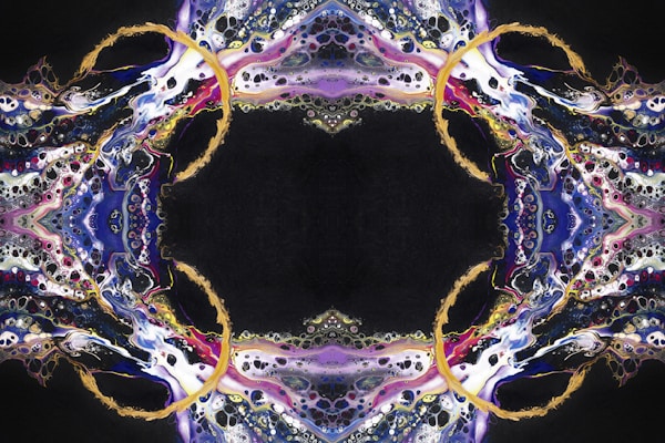 An intricate, symmetrical abstract pattern resembling a kaleidoscope, featuring swirling colors and shapes that appear fluid and dynamic. The design is centralized with elaborate loops and delicate lace-like details, blending hues of blue, purple, white, and gold.