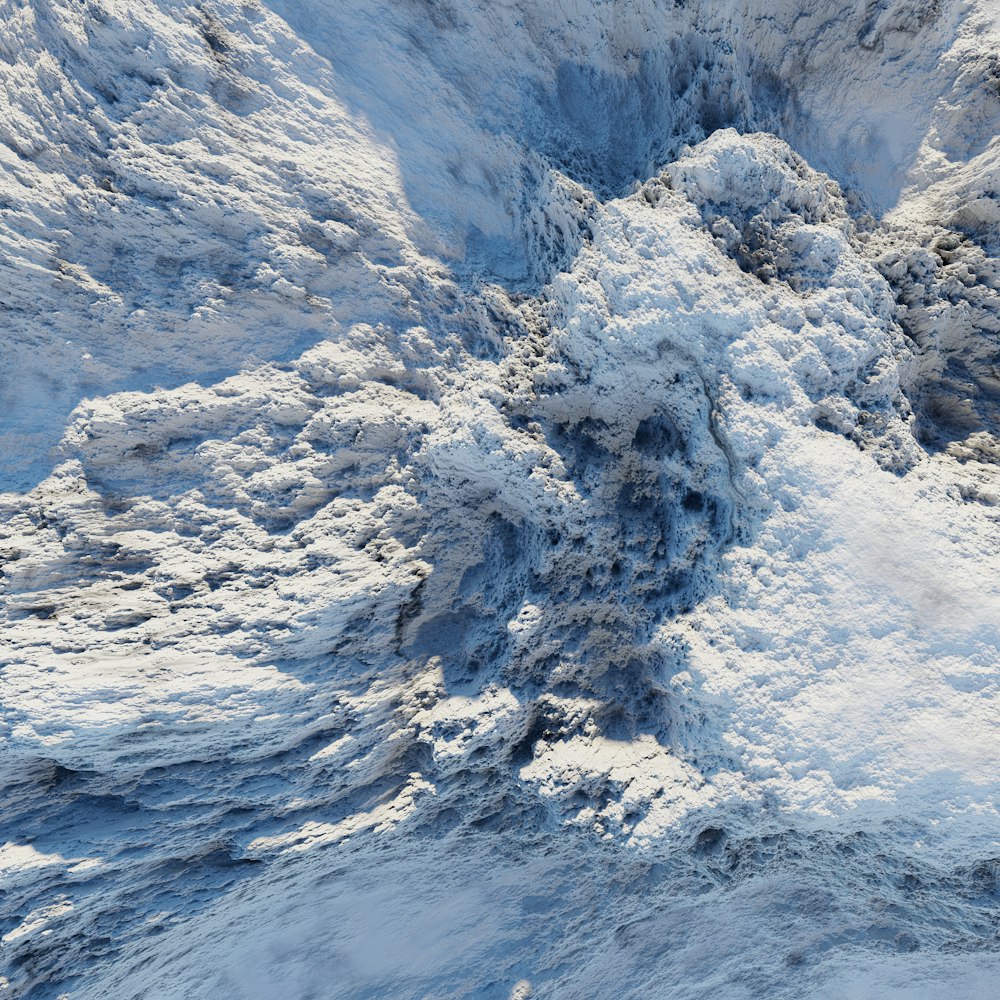 an aerial view of a snow covered mountain