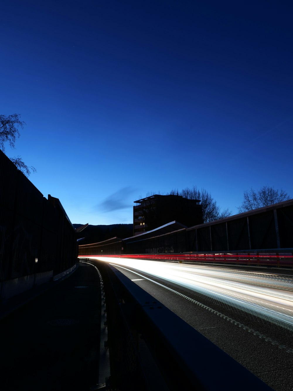 a long exposure shot of a street at night