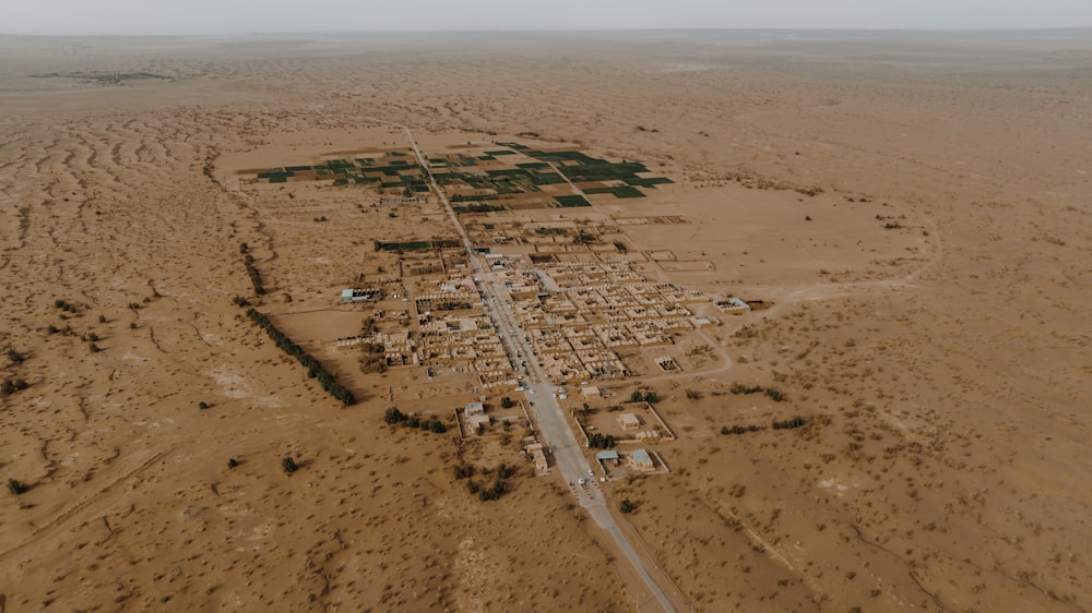 an aerial view of a village in the middle of the desert