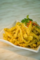 Mirchi bajji, deep-fried green chilies coated in crunchy batter.