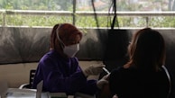 A healthcare worker providing medical assistance in a rural village.
