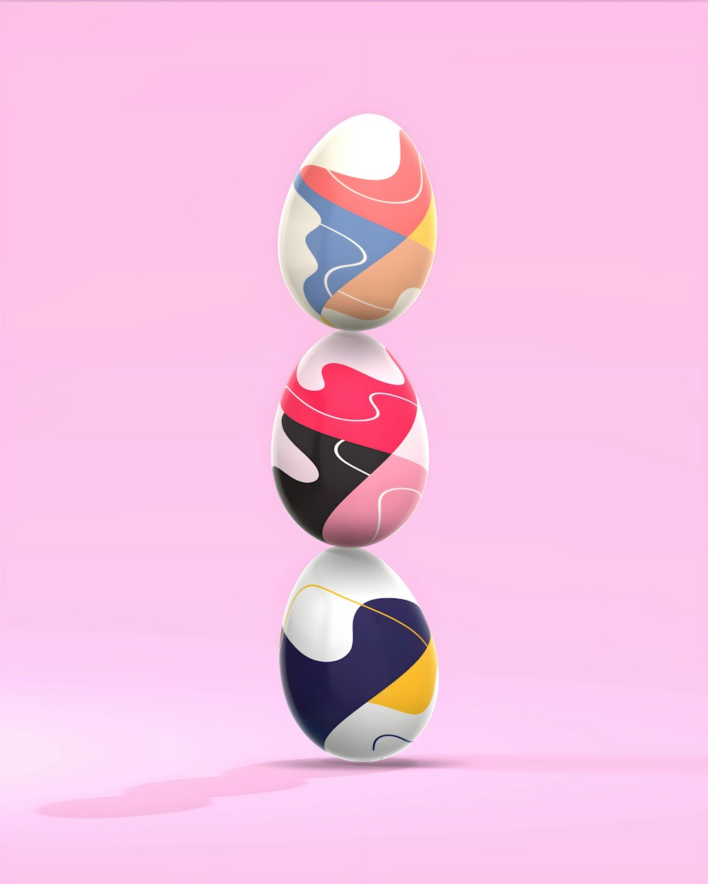 three colorful balls stacked on top of each other