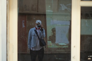 a man taking a picture of himself in a mirror