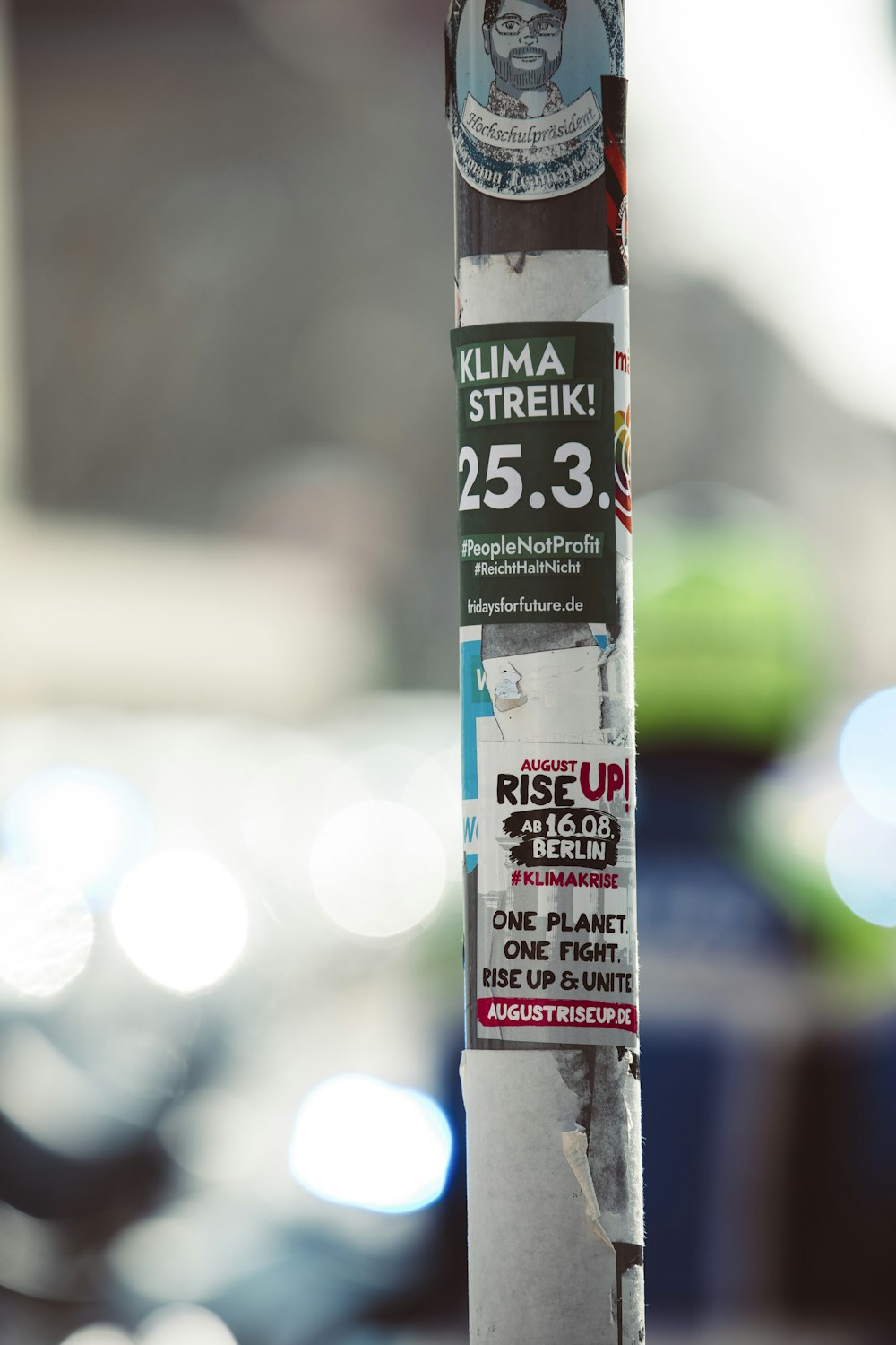 a pole with a bunch of stickers on it