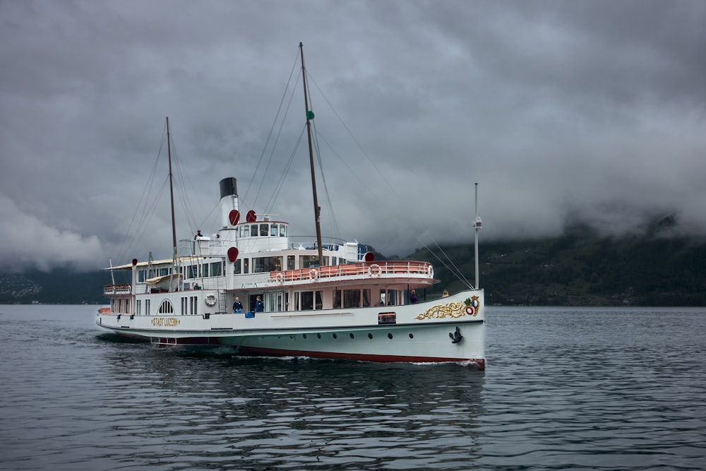 a large white boat floating on top of a body of water