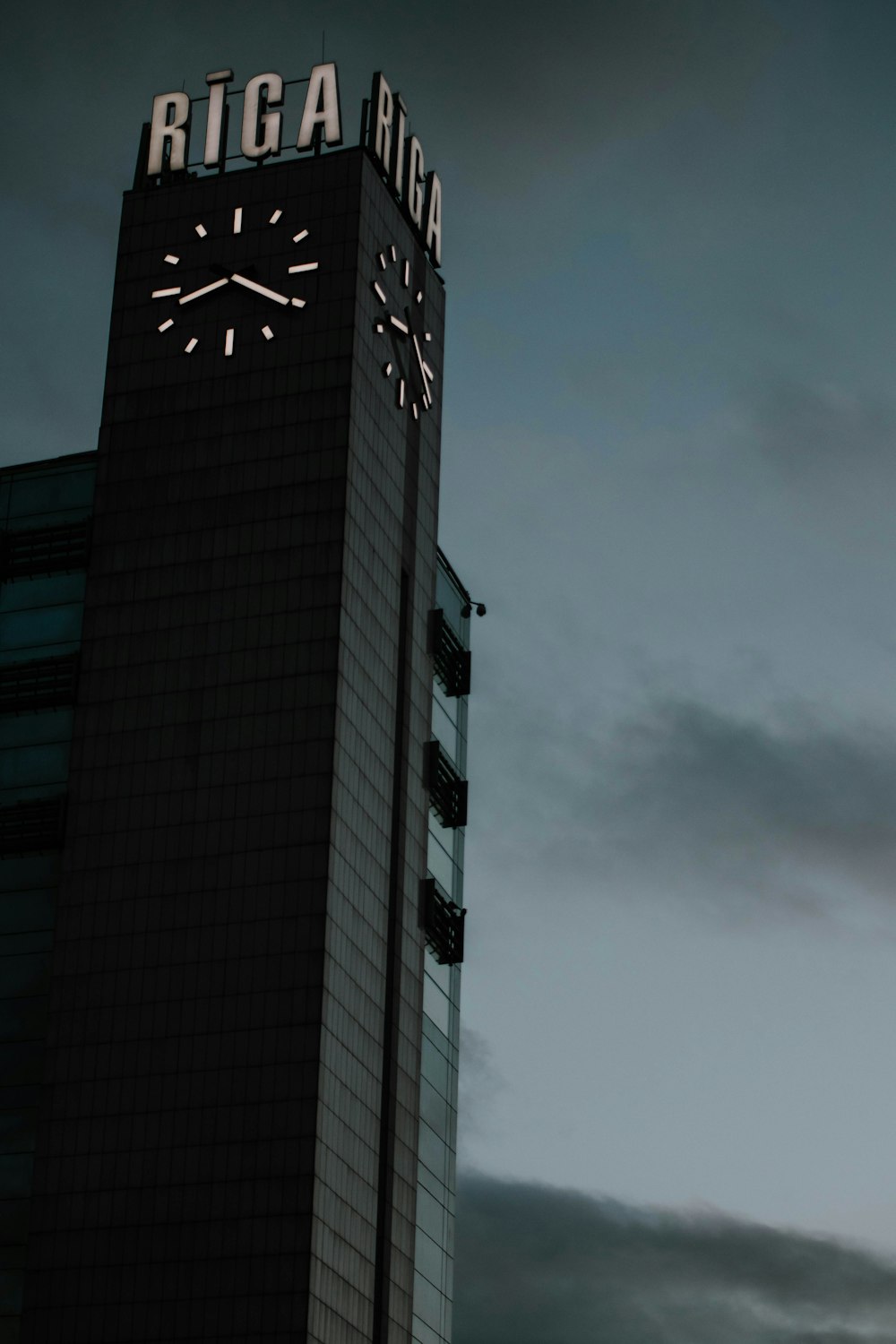 a tall building with a clock on the top of it