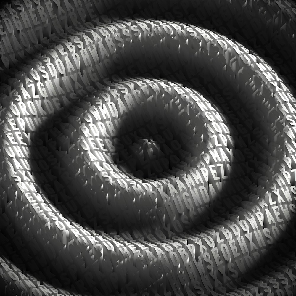 a black and white photo of a spiral design