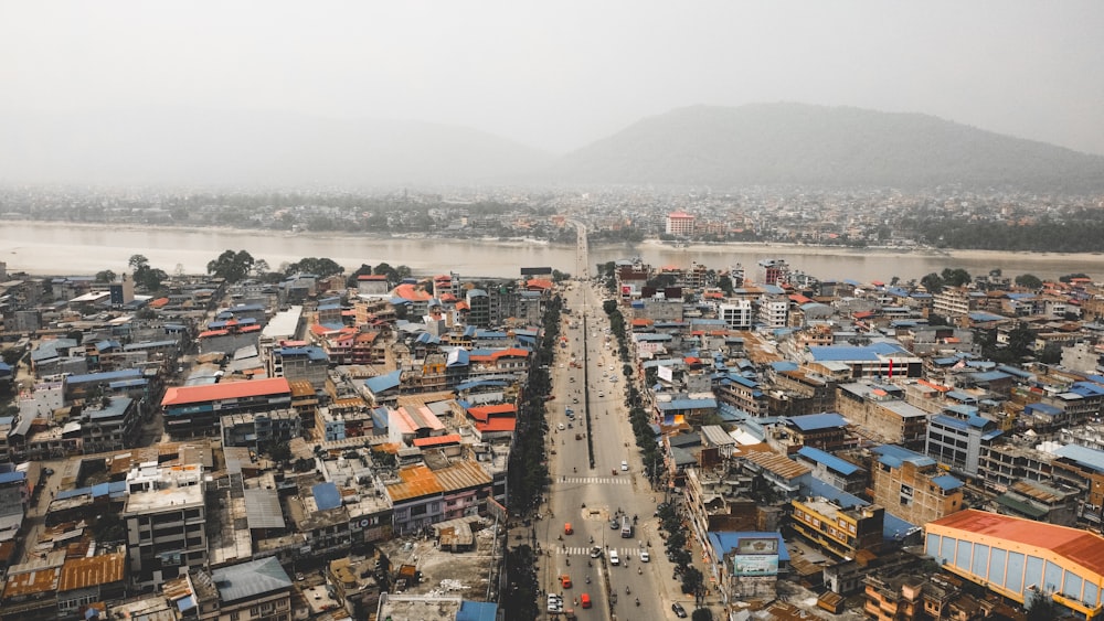 an aerial view of a city with lots of houses