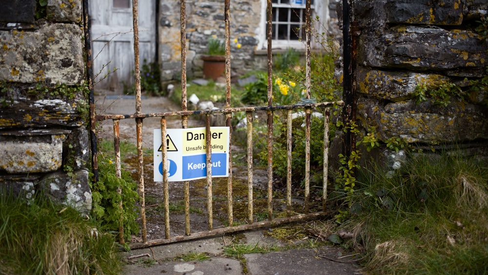 a gate that has a sign on it