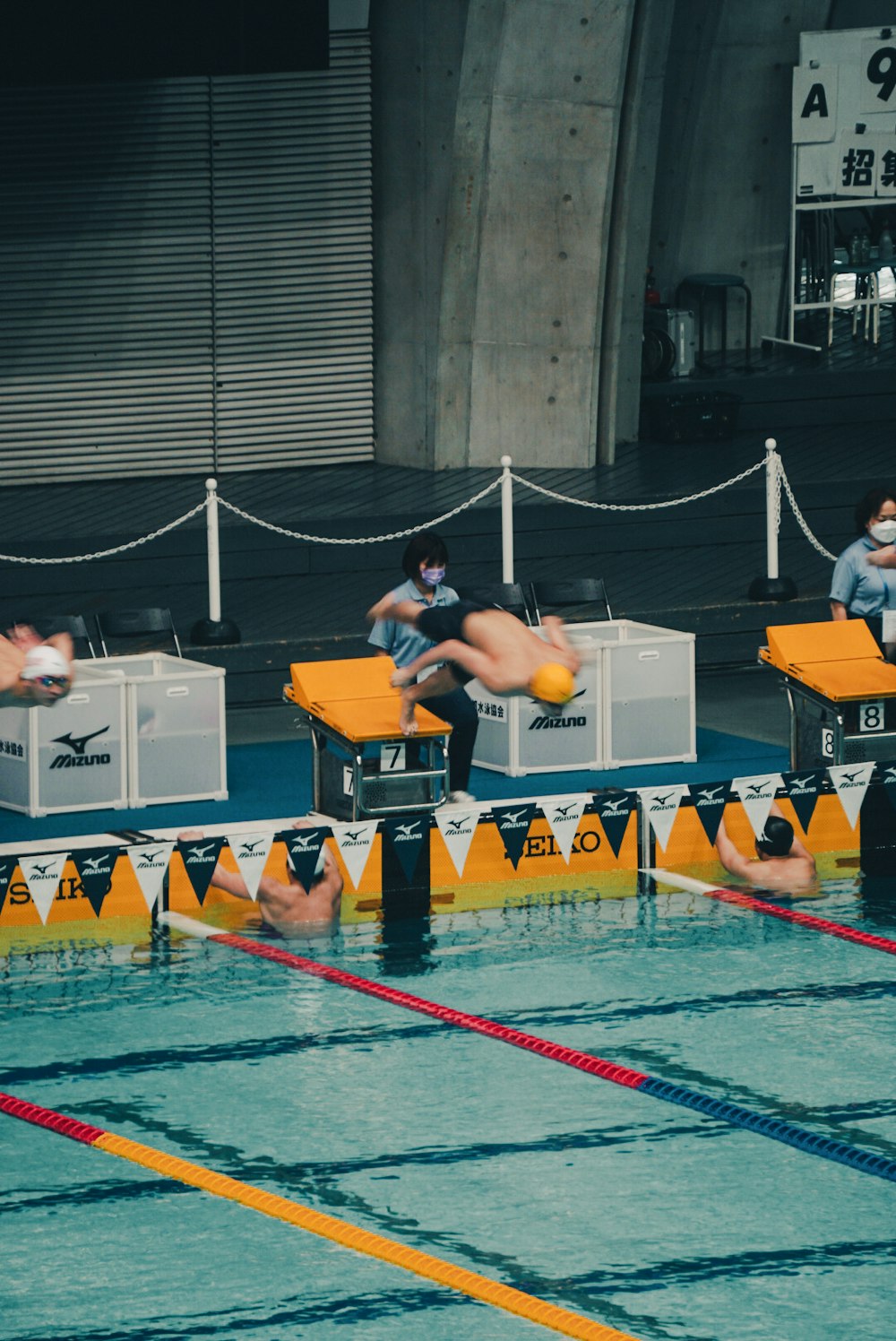 a group of swimmers in a swimming pool