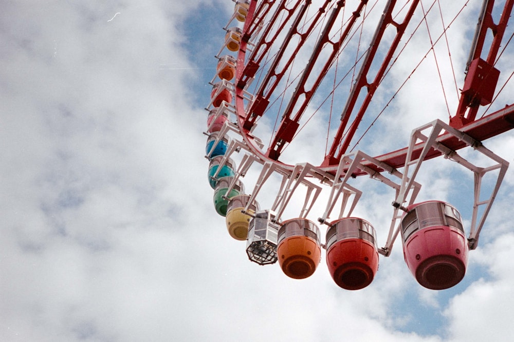 a ferris wheel with a bunch of colorful balls hanging from it