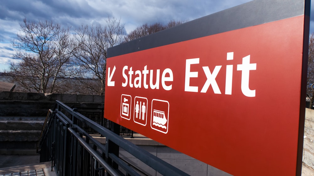 a red and black sign that says state exit