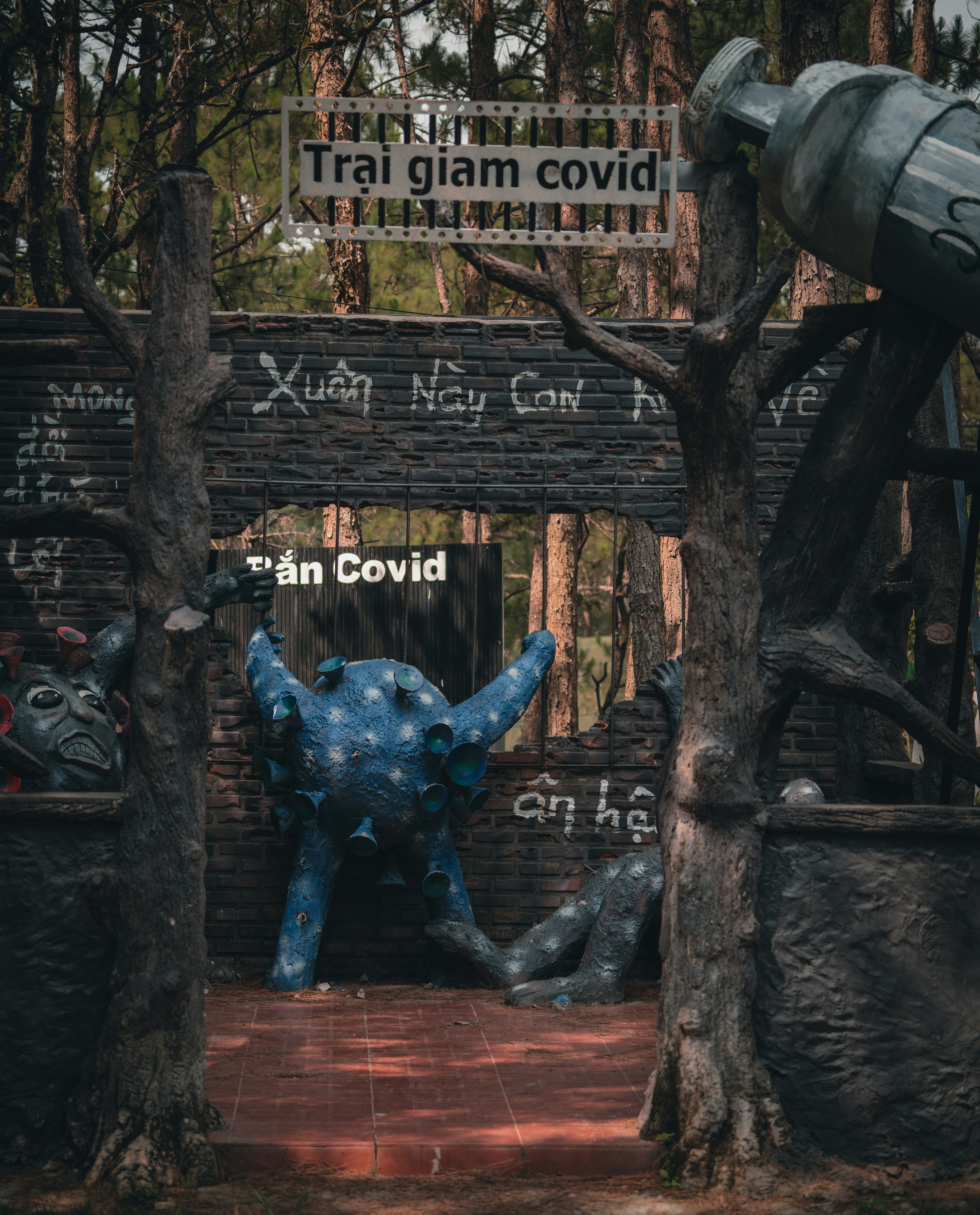 a statue of an elephant in front of a sign