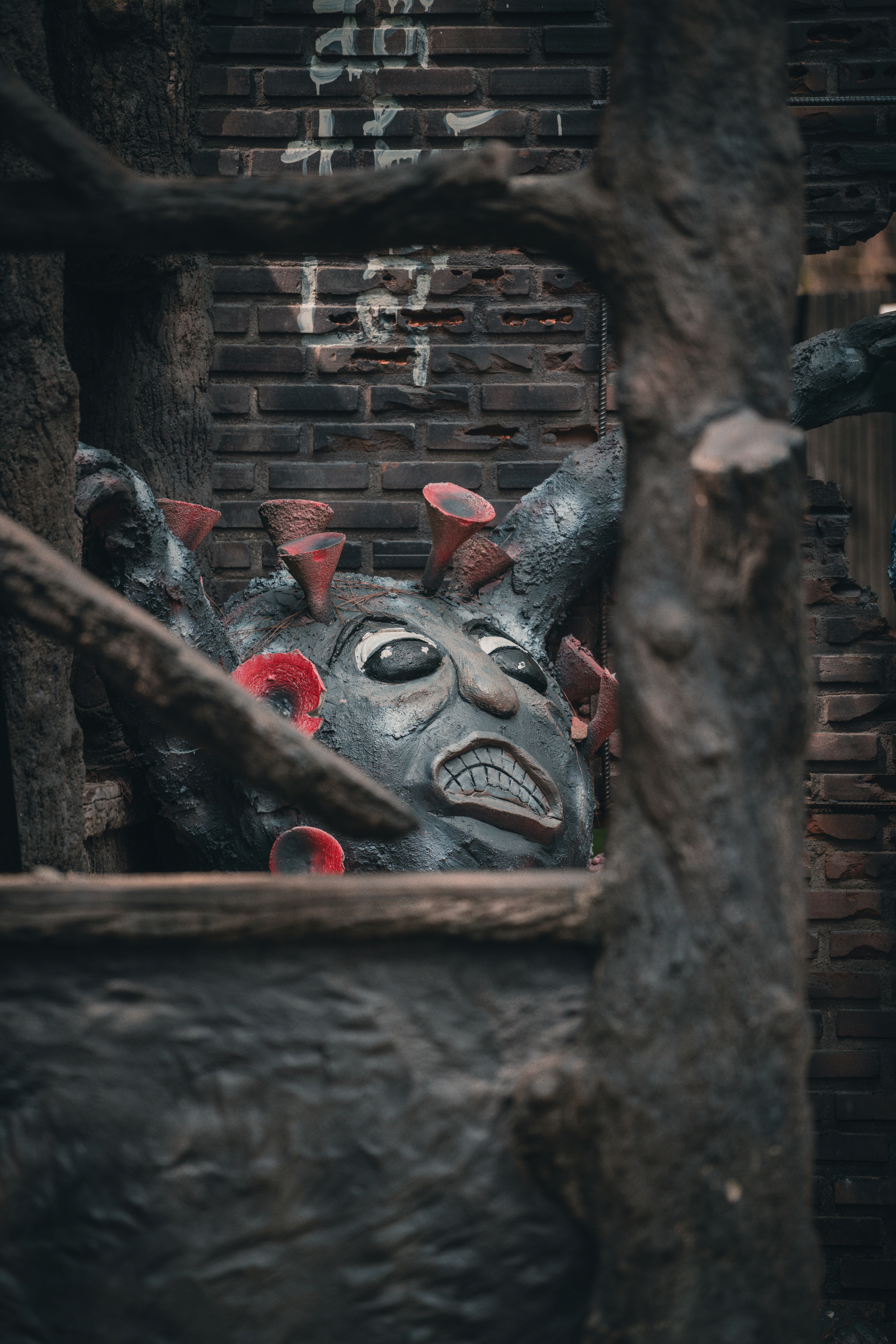 a statue of a demon in a wooden box