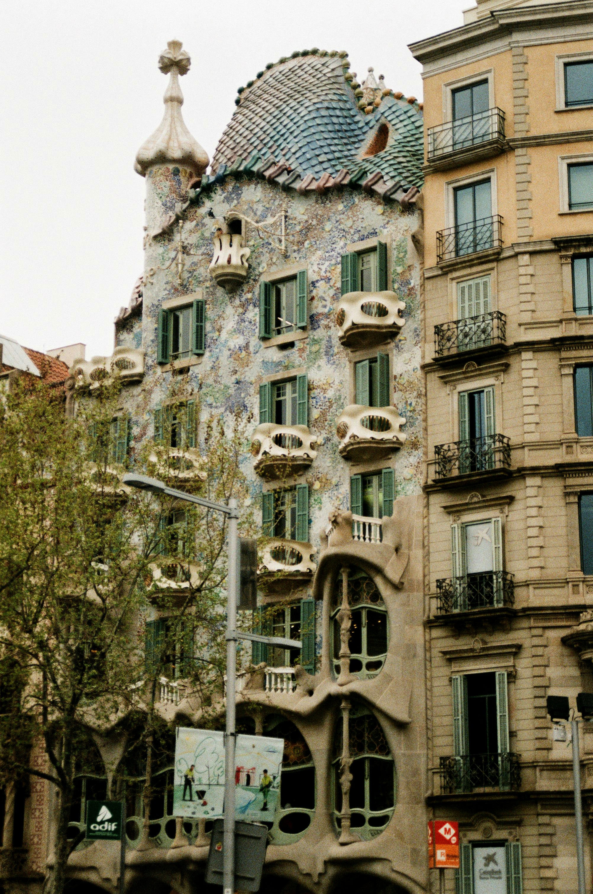 a tall building with a lot of windows and balconies