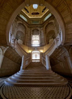 a very large staircase in a very big building