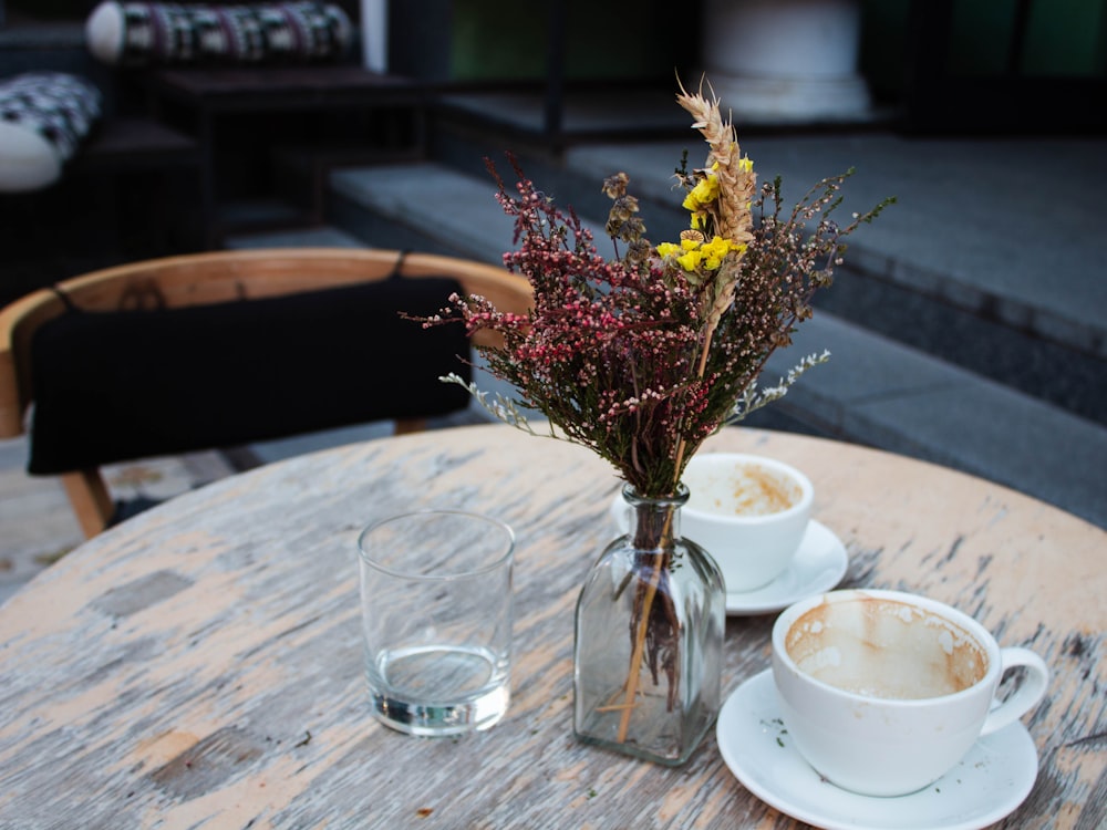 two cups of coffee sit on a table