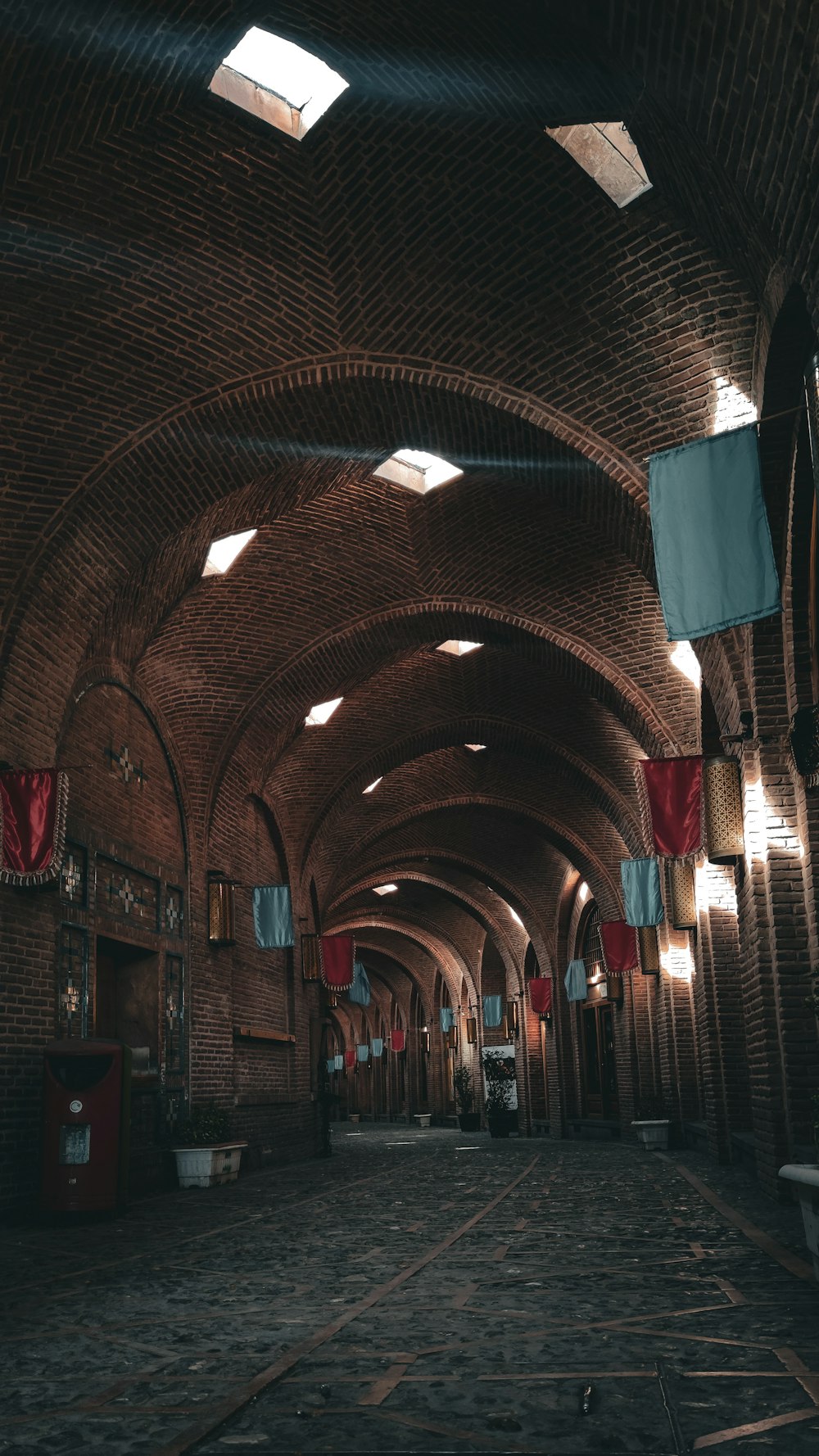 a very long brick building with lots of windows